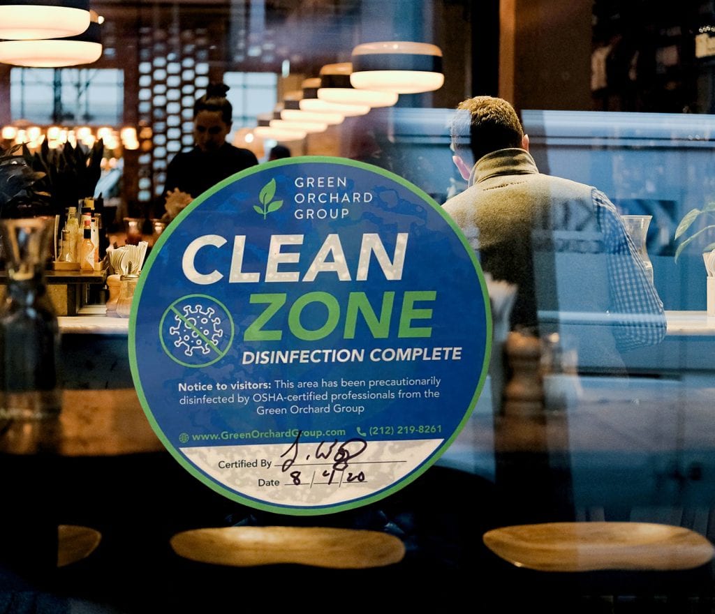 Green Orchard Group Restaurant Disinfection Sticker, showing they have been professionally disinfected for covid-19. 