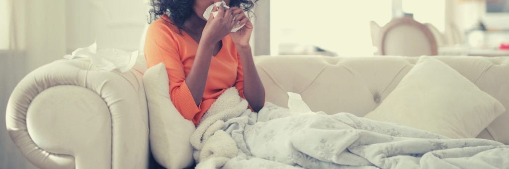 A woman is experiencing flu-like symptoms that may be an indicator of mold. 