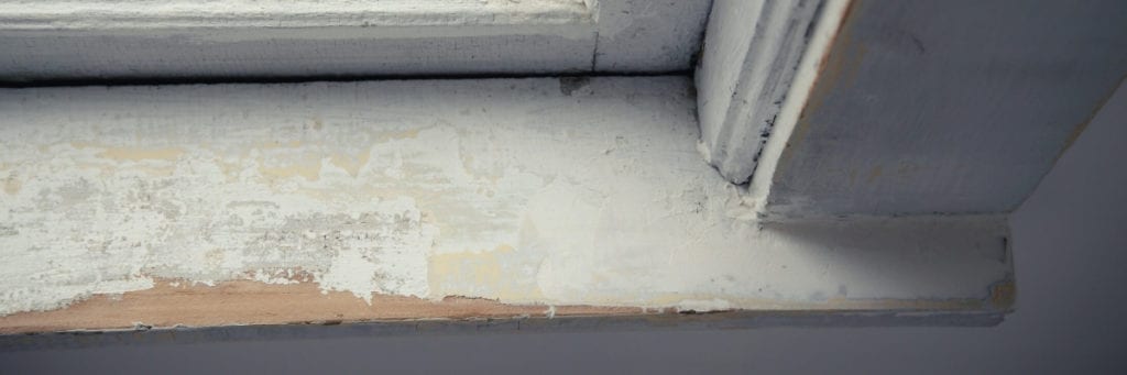 A window sill with damaged and deteriorated paint is a potential lead-based paint hazard.